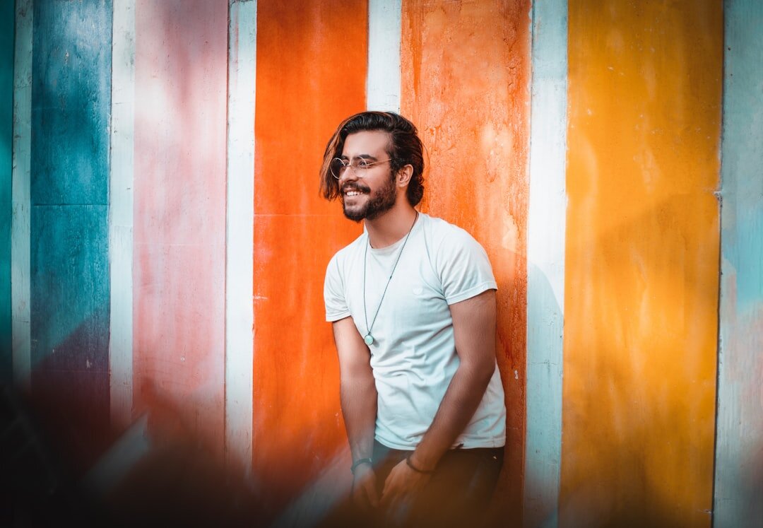 Portrait of a young man smiling, casual creative professional